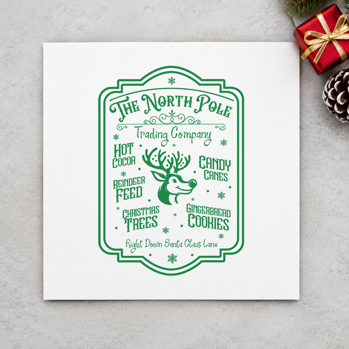North Pole Trading Company Sign craft stamp in green ink on cardstock, an easy option for store album page.