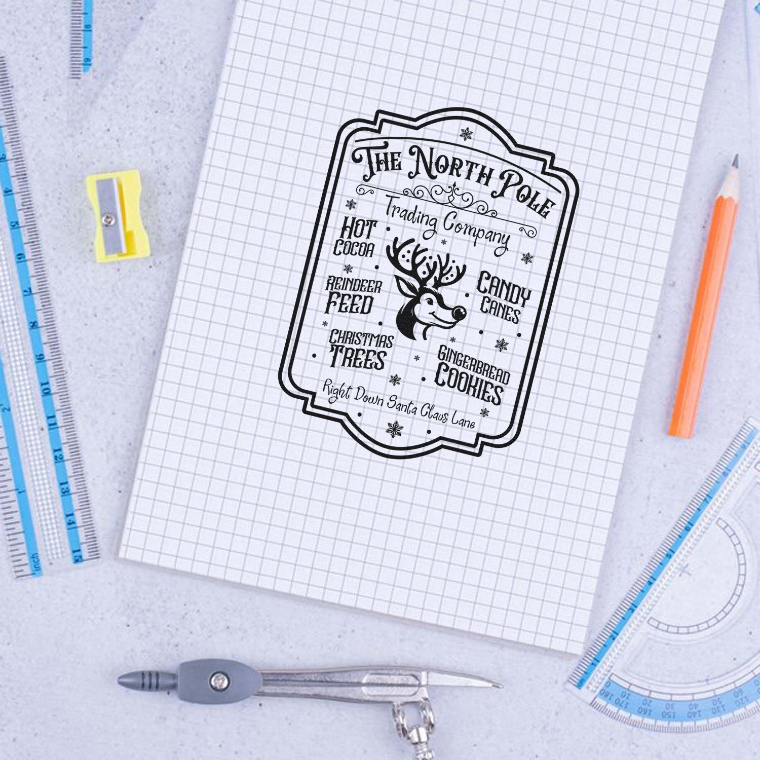 Holiday rubber stamp design for The North Pole Trading Company, featuring reindeer feed, hot cocoa, candy canes and cookies.