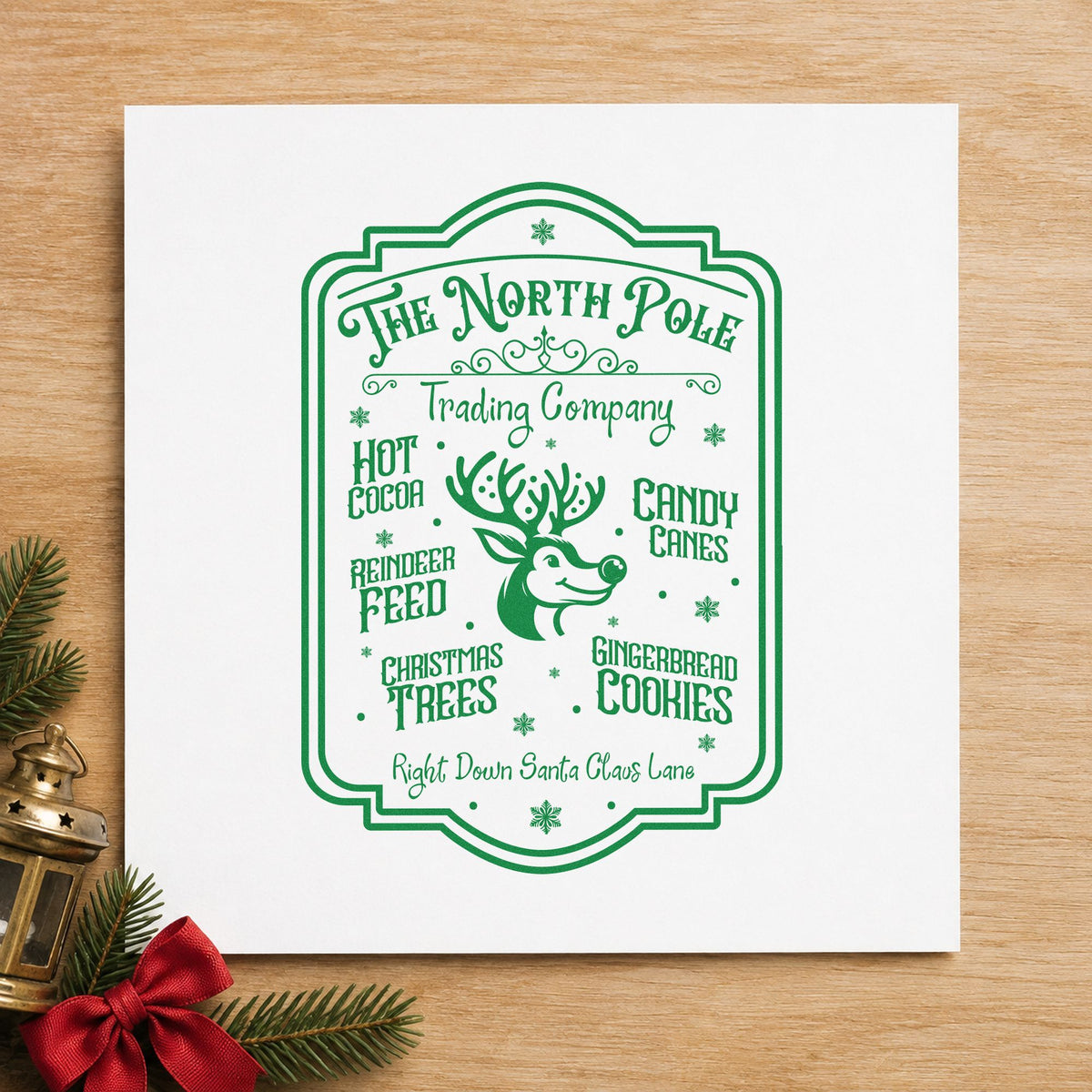 North Pole Trading Company Sign craft stamp imprint in green ink on a handmade project, one idea being receipt book slips.