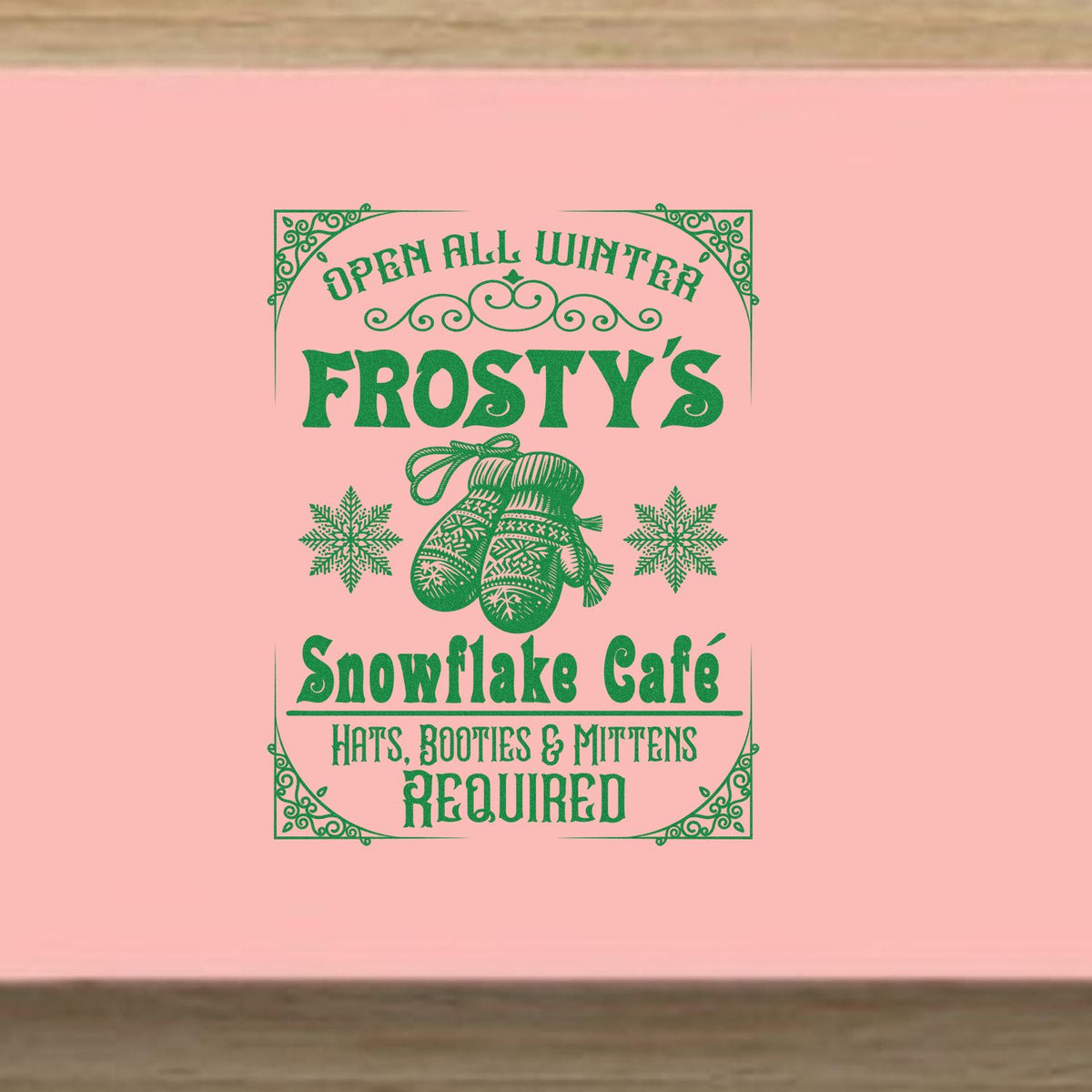 Frosty's Snowflake Cafe Sign rubber stamp shown in green ink, stamped for projects such as outfit album page.