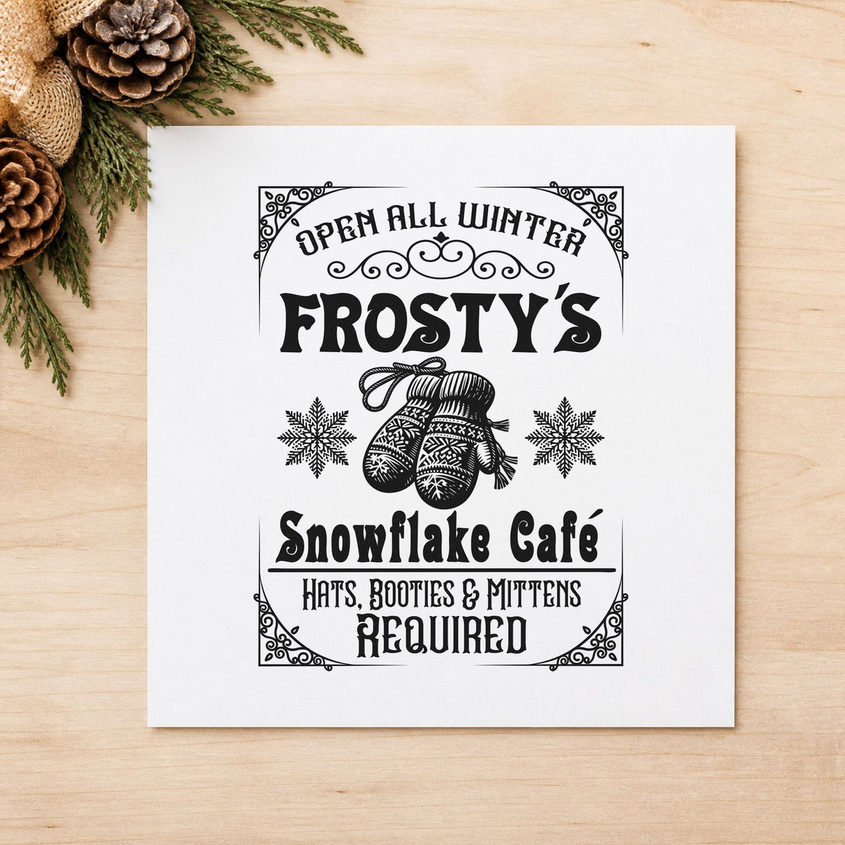Frosty's Snowflake Cafe Sign craft stamp imprint in black ink on a handmade project, one idea being coat check tags.