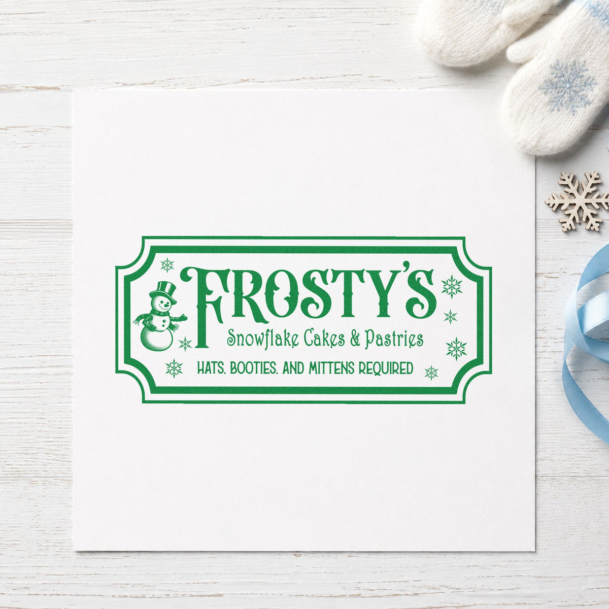 Frosty's Snowflake Cafe Pastries craft stamp in green ink on cardstock, an easy option for display case album.