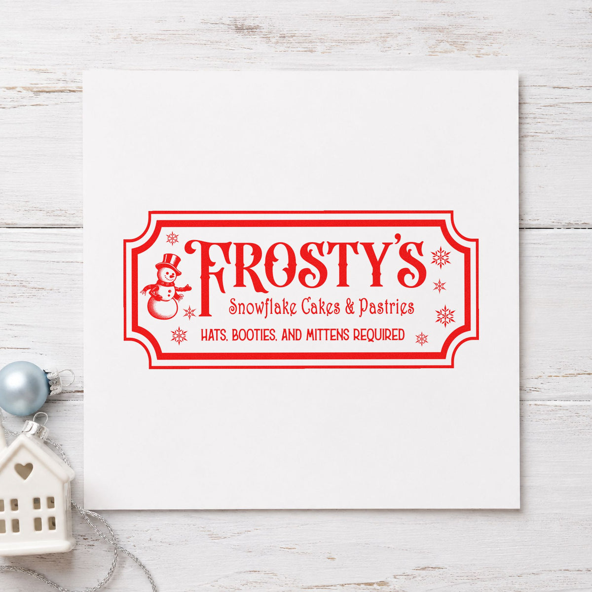 Frosty's Snowflake Cafe Pastries rubber stamp shown in red ink, stamped for projects such as tray kind labels.