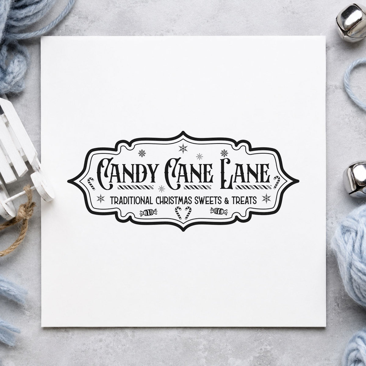 Candy Cane Lane Vintage Sign craft stamp imprint in black ink on a handmade project, one idea being long strip tags.