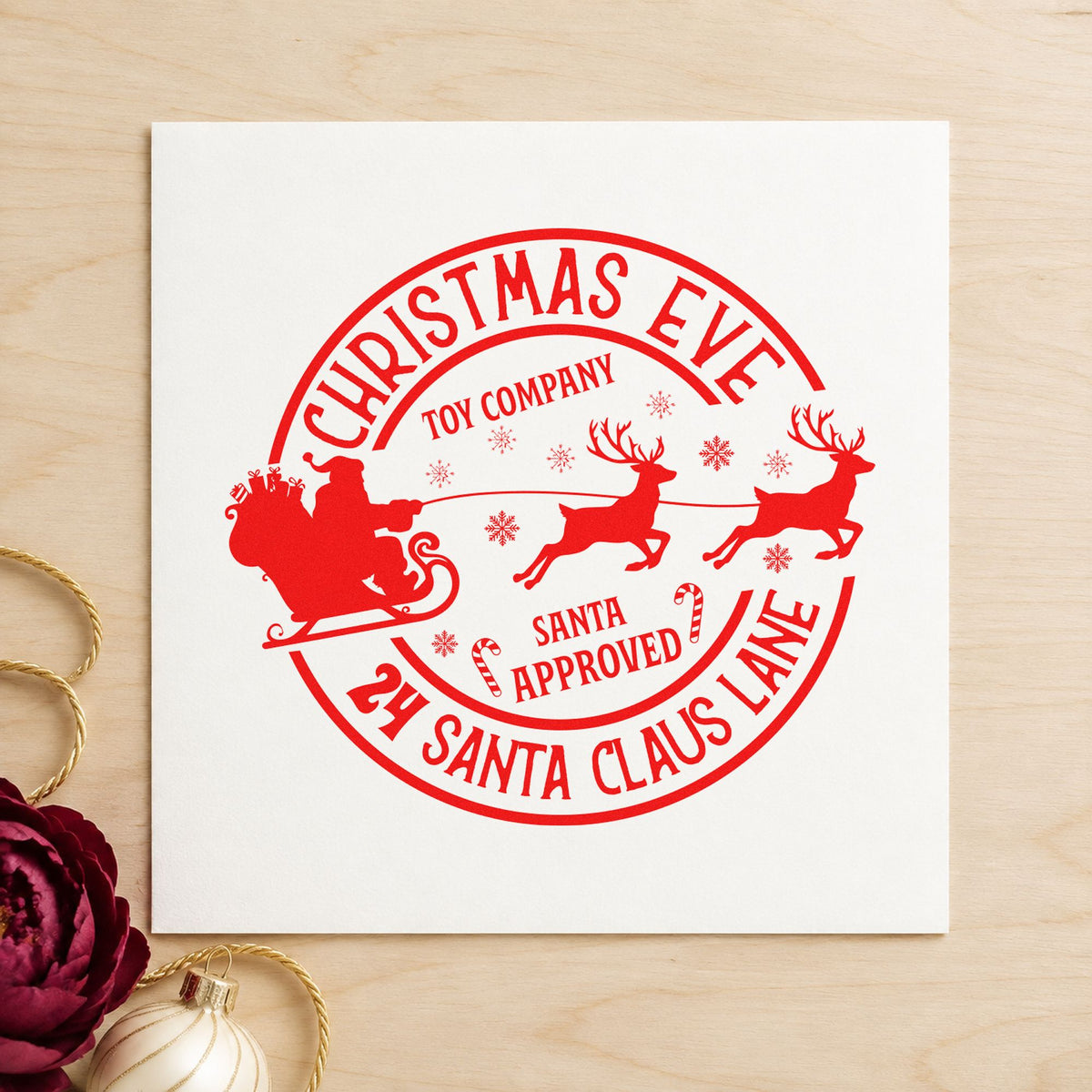 Christmas Eve Toy Company rubber stamp shown in red ink, stamped for projects such as parts bin labels.