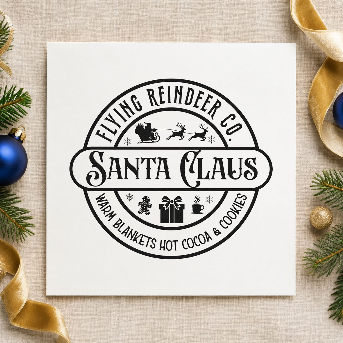 Flying Reindeer Santa Claus Badge craft stamp imprint in black ink on a handmade project, one idea being package deal tags.