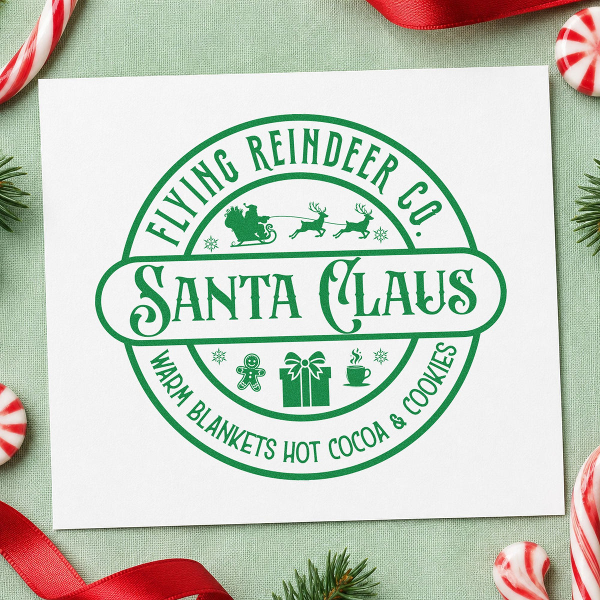 Flying Reindeer Santa Claus Badge craft stamp imprint in green ink on a handmade project, one idea being booking slip cards.