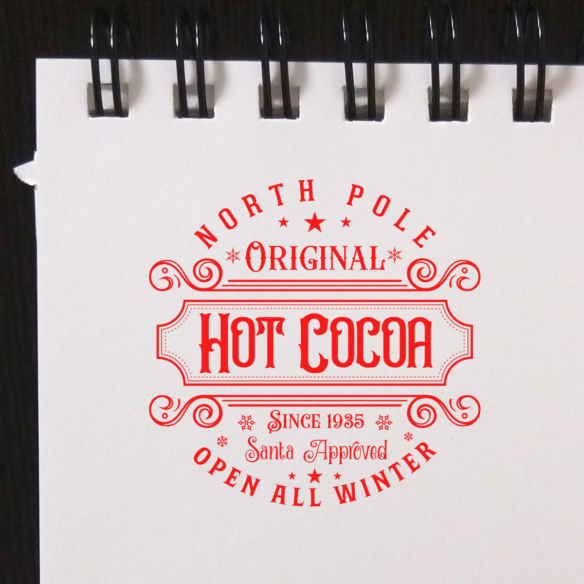 North Pole Original Hot Cocoa rubber stamp shown in red ink, stamped for projects such as brand album page.