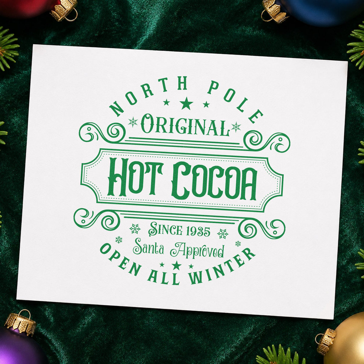 North Pole Original Hot Cocoa craft stamp imprint in green ink on a handmade project, one idea being heritage slip cards.