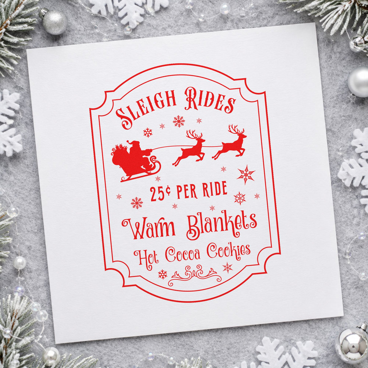 Sleigh Rides Warm Blankets craft stamp in red ink on cardstock, an easy option for booth skirt printing.
