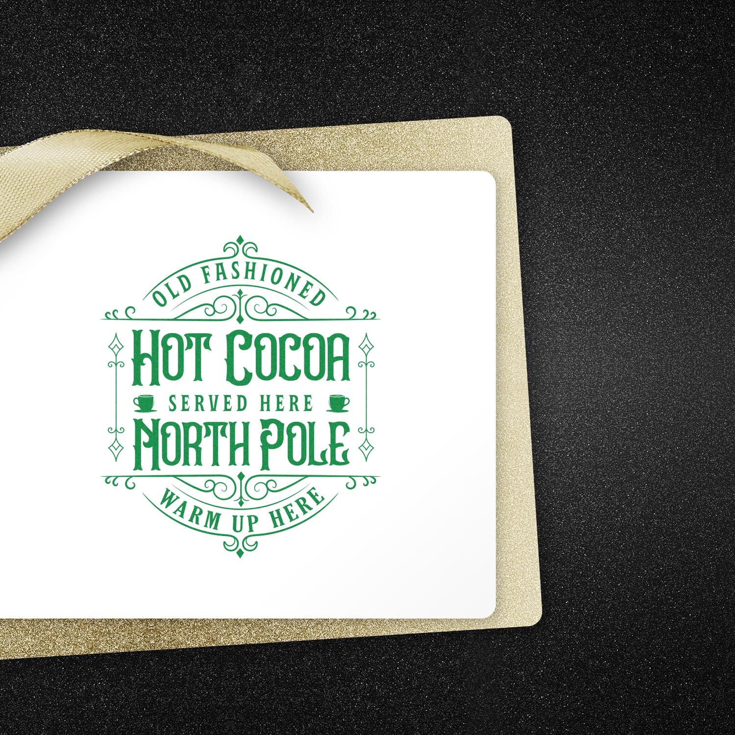 Old Fashioned Hot Cocoa North Pole rubber stamp design for holiday cards, featuring festive vintage text and a gold ribbon.