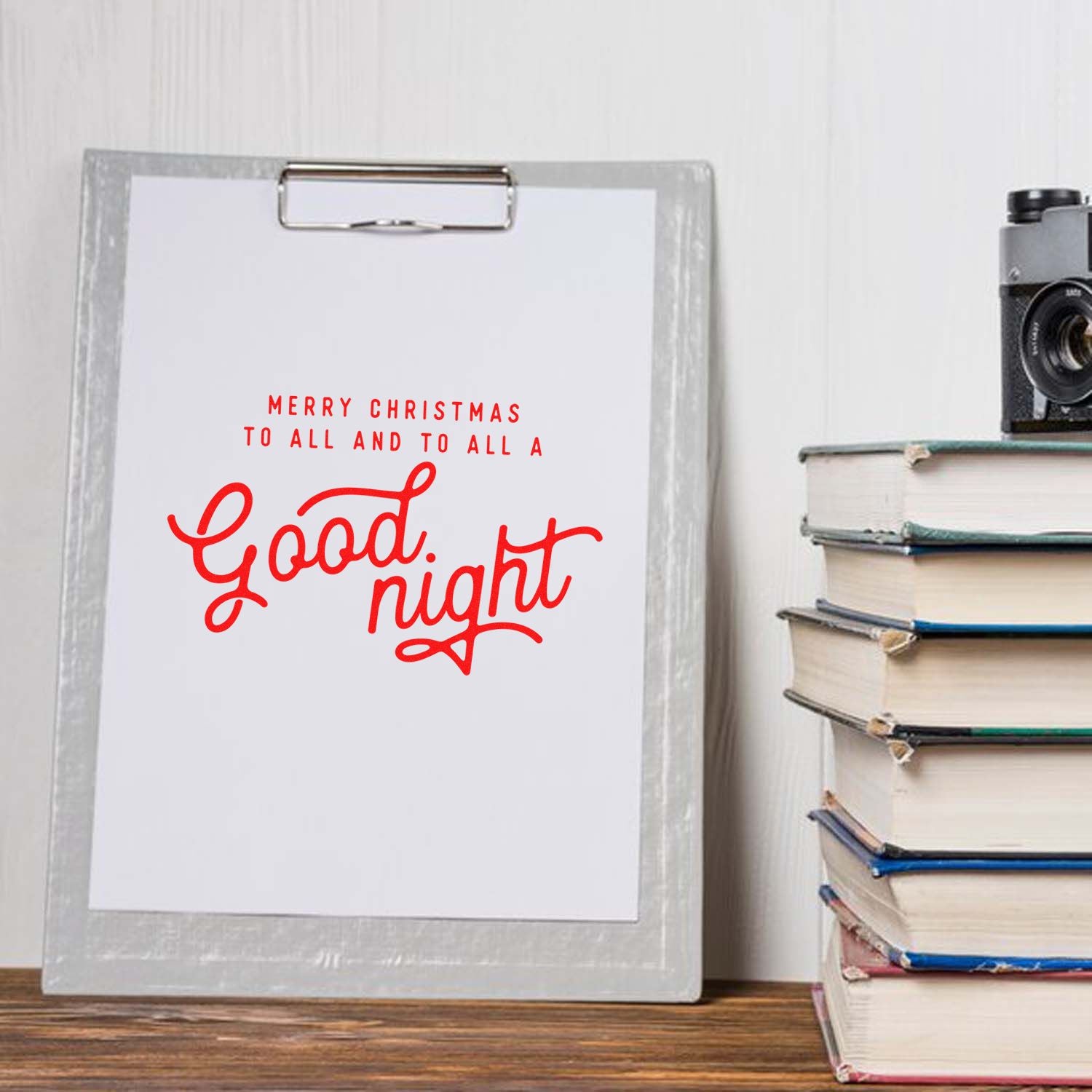 Christmas rubber stamp design with red Merry Christmas to all and to all a Good night lettering on a clipboard display.