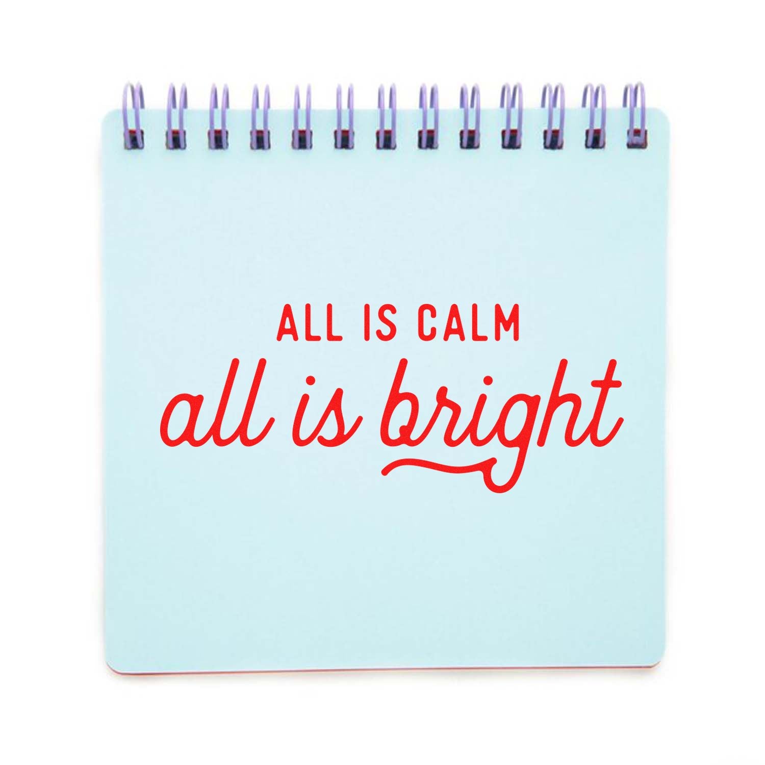 All is calm, all is bright rubber stamp design with festive handwritten text on a light blue notebook page.