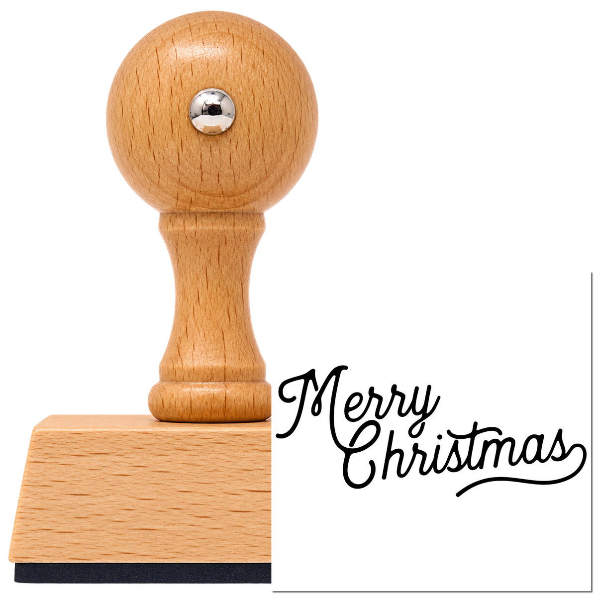 Merry Christmas Underline Flourish Vintage Pro rubber stamp in European beech wood with a round knob handle, shown beside its black imprint.