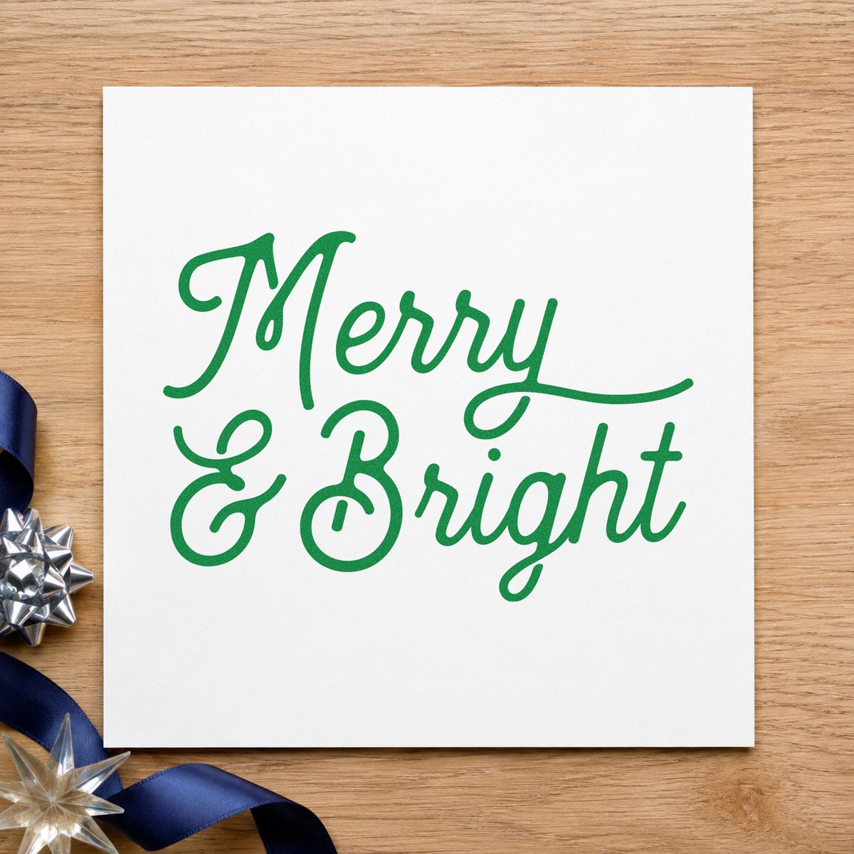 Merry And Bright Script craft stamp in green ink on cardstock, an easy option for swash study album.