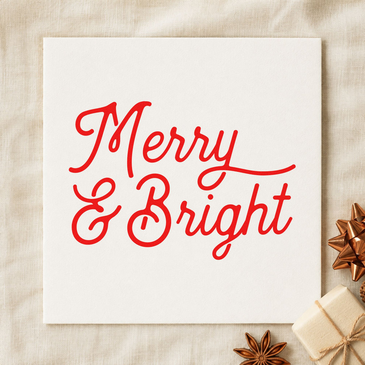 Merry And Bright Script craft stamp in red ink on cardstock, an easy option for cushion face printing.