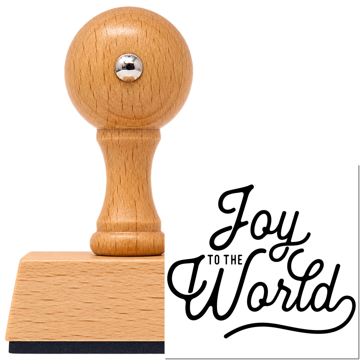 Joy To The World Script Lettering Vintage Pro rubber stamp in European beech wood with a round knob handle, shown beside its black imprint.