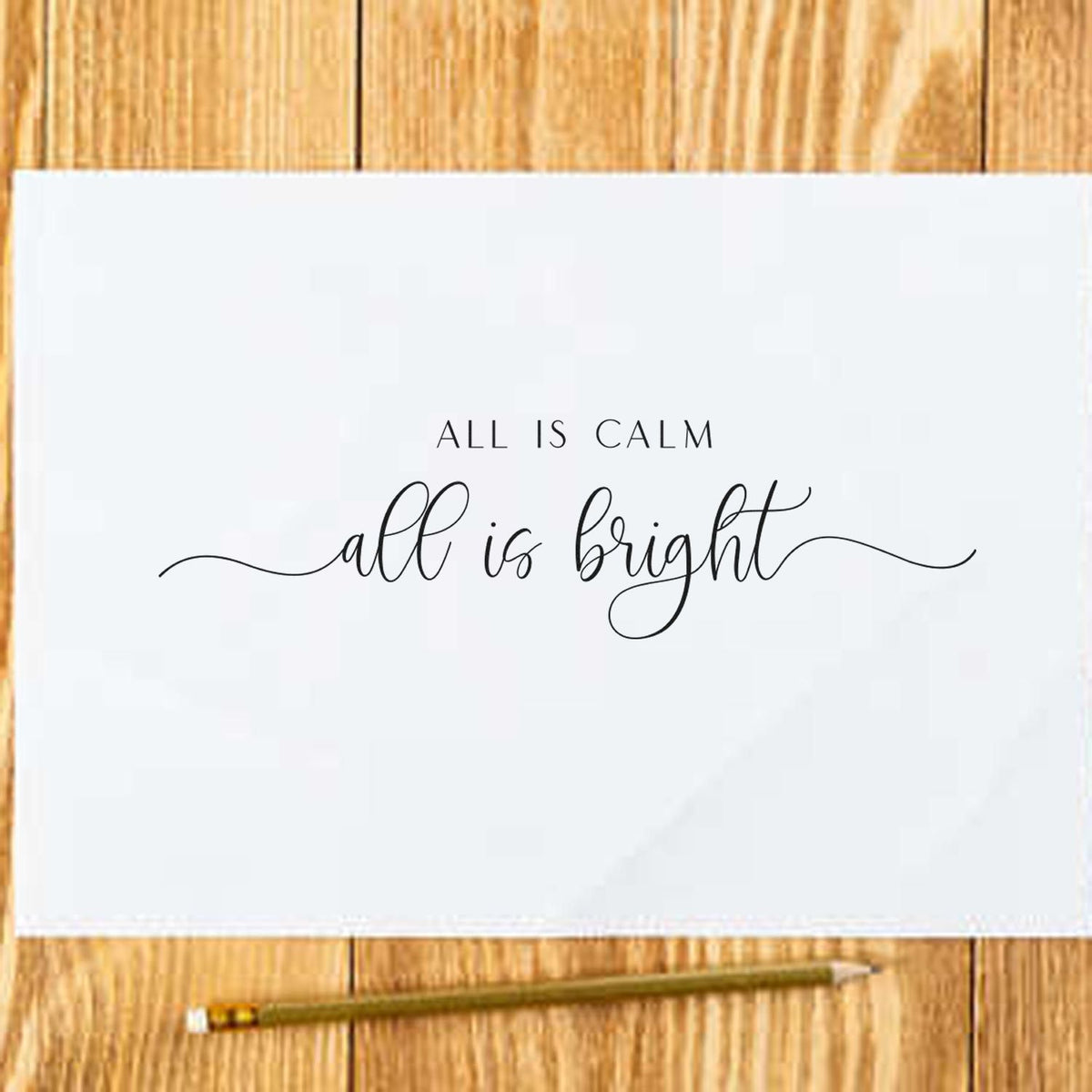All Calm Bright Fine Script Premium Wooden Stamp - Vintage Pro imprint stamped in black ink. The words "All is calm all is bright" appear in delicate lettering with long thin flourishes.