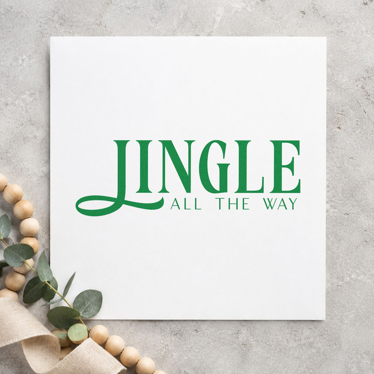 Jingle All The Way Serif craft stamp imprinted in green ink on paper, a design suited to framed wide mat.