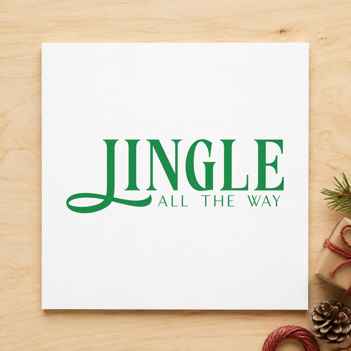 Jingle All The Way Serif craft stamp imprint in green ink on a handmade project, one idea being formal note slips.