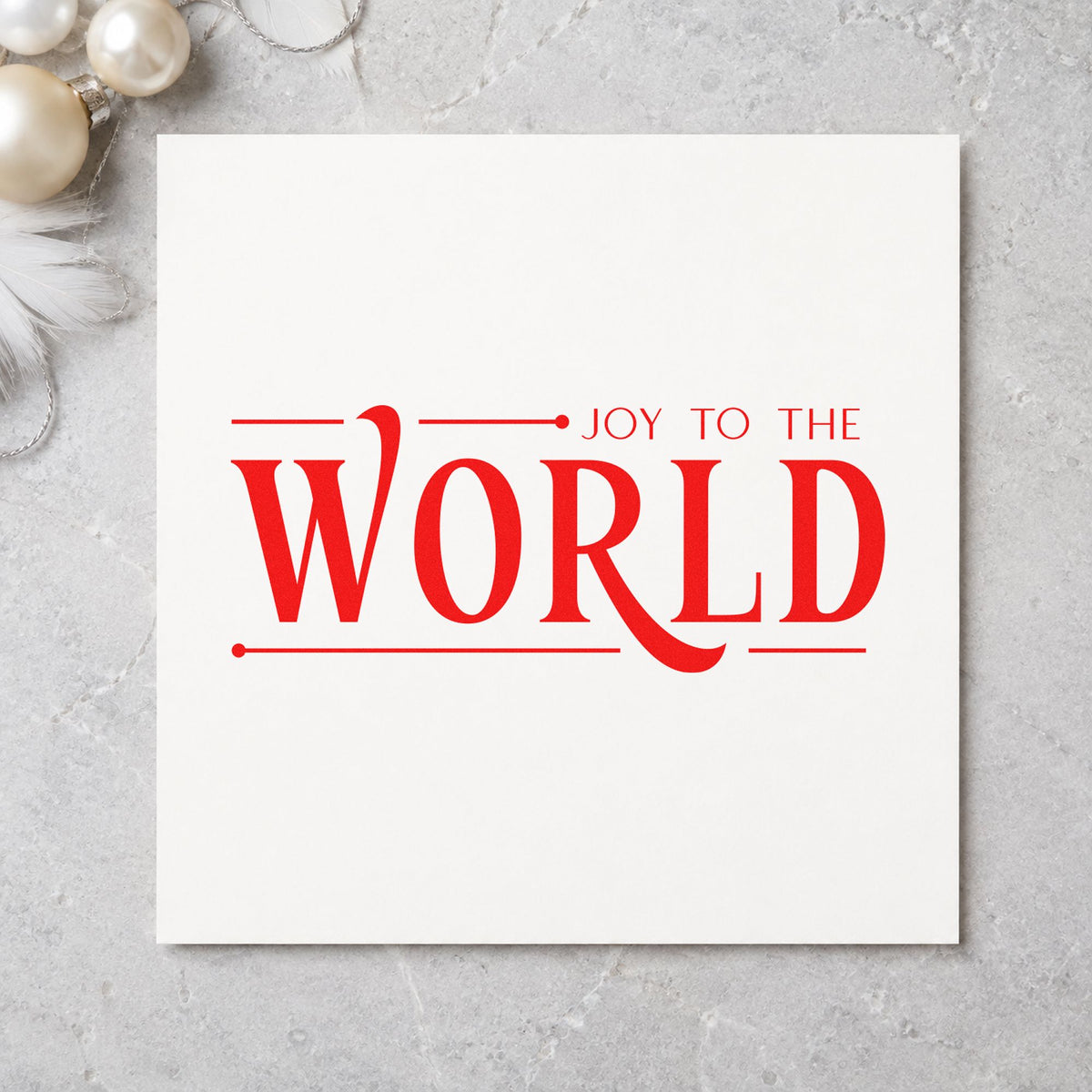 Joy To The World Serif craft stamp in red ink on cardstock, an easy option for runner end printing.
