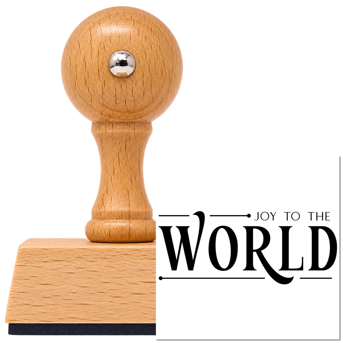 Joy To The World Serif Vintage Pro rubber stamp in European beech wood with a round knob handle, shown beside its black imprint.