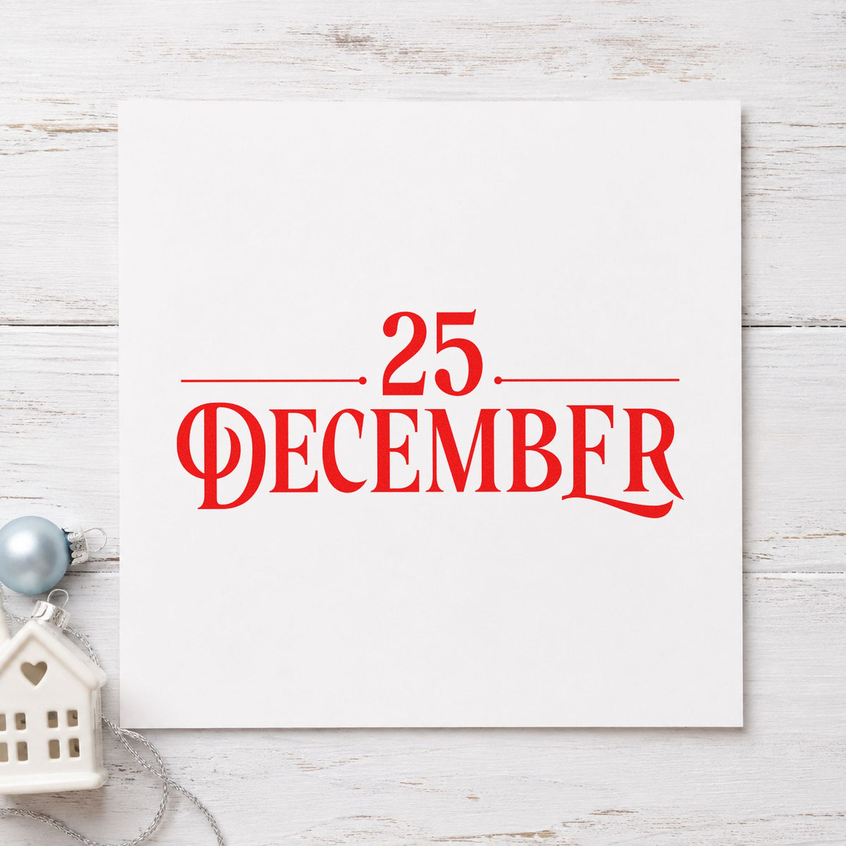 Twenty Five December Lettering craft stamp in red ink on cardstock, an easy option for cushion face printing.