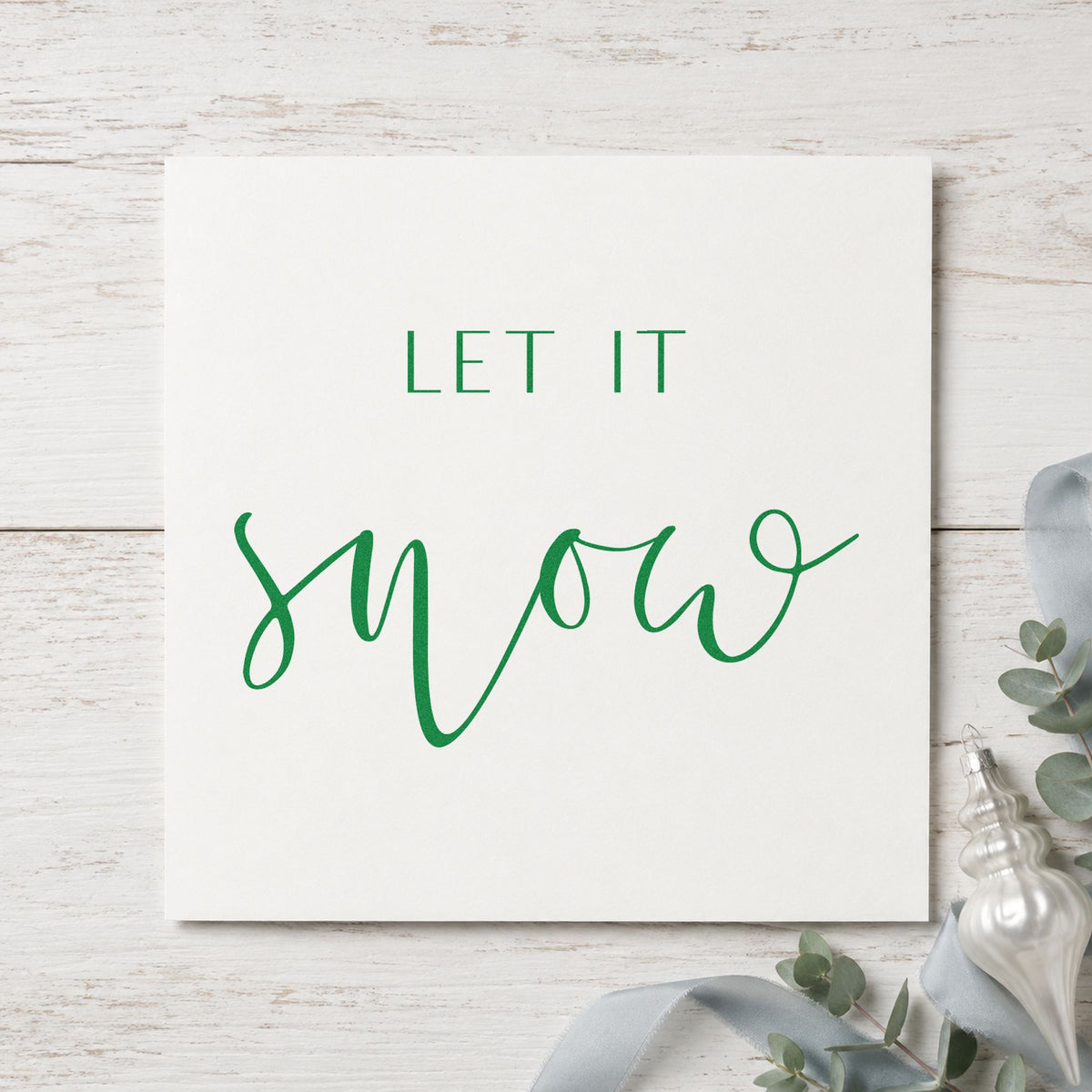 Let It Snow Fine Script craft stamp in green ink on cardstock, an easy option for calm album page.