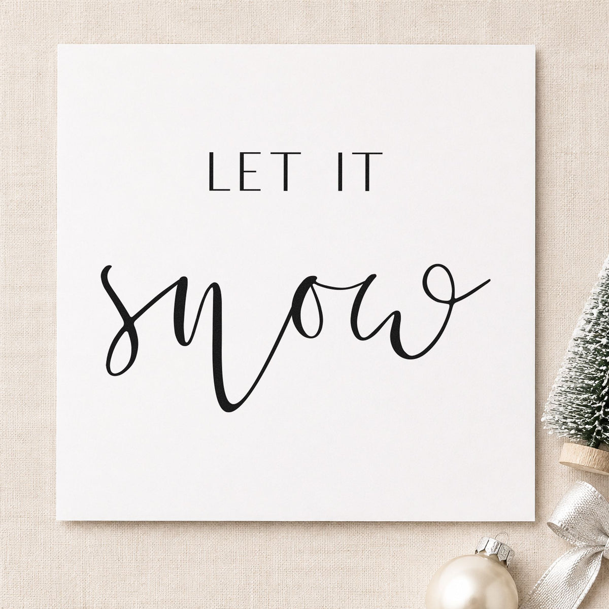 Let It Snow Fine Script craft stamp imprint in black ink on a handmade project, one idea being bath salt gift tags.