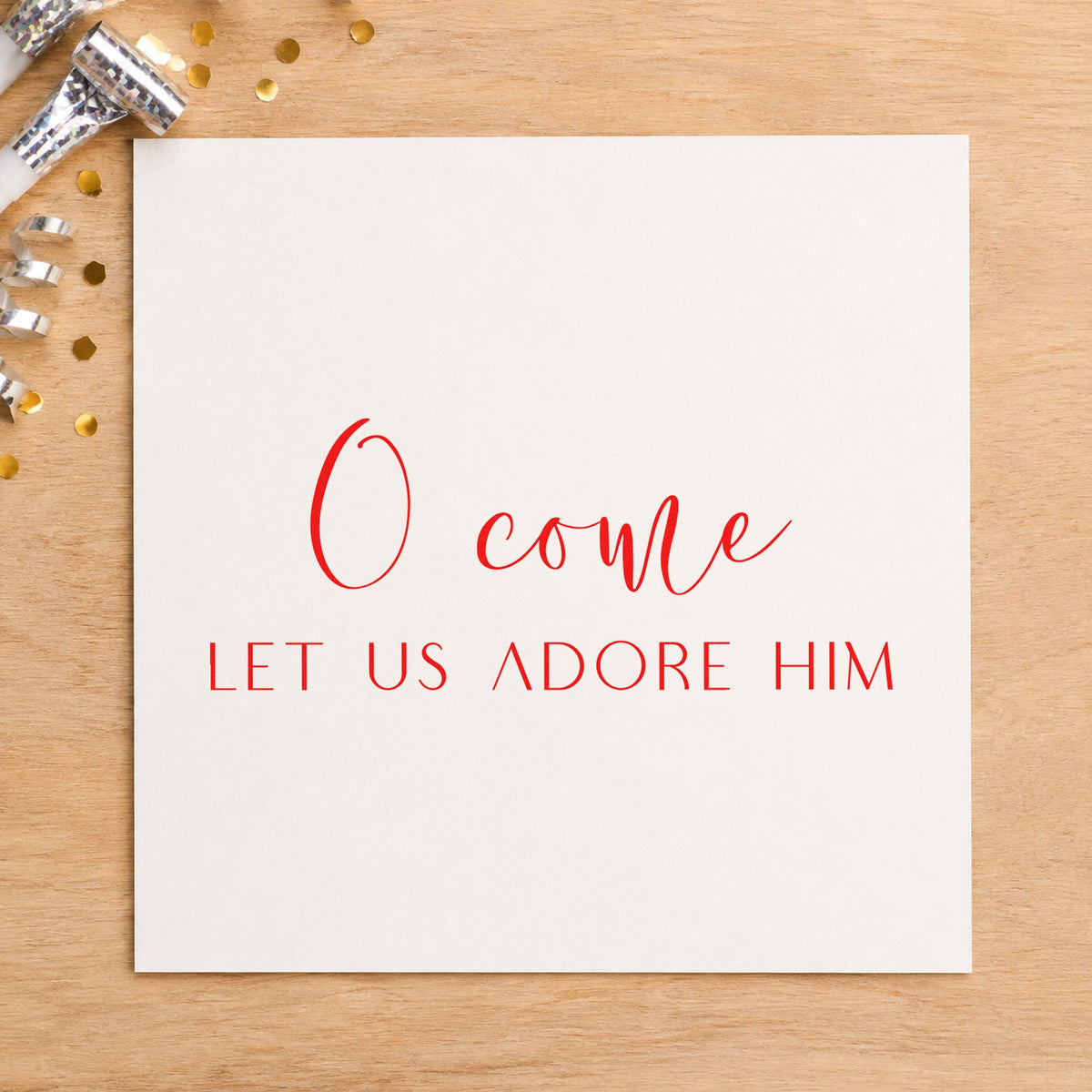 O Come Let Us Adore Him rubber stamp shown in red ink, stamped for projects such as cup tray labels.