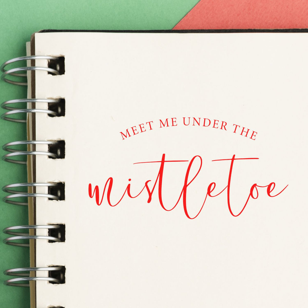 Meet Me Under Mistletoe Script rubber stamp shown in red ink, stamped for projects such as curved album header.