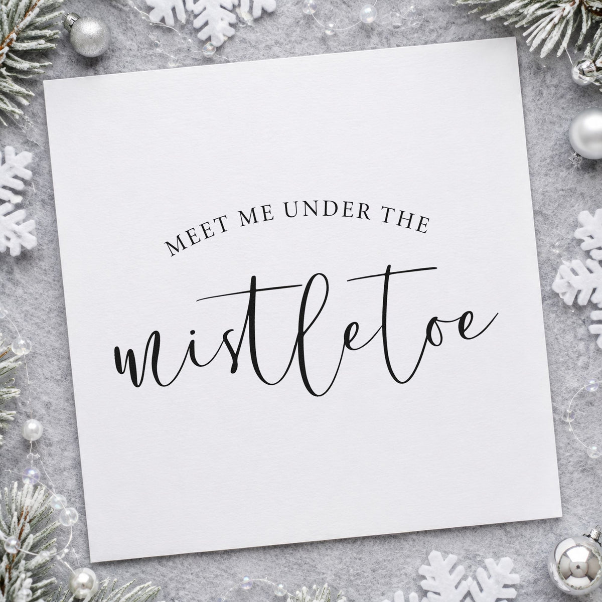 Meet Me Under Mistletoe Script craft stamp imprint in black ink on a handmade project, one idea being dome top gift tags.