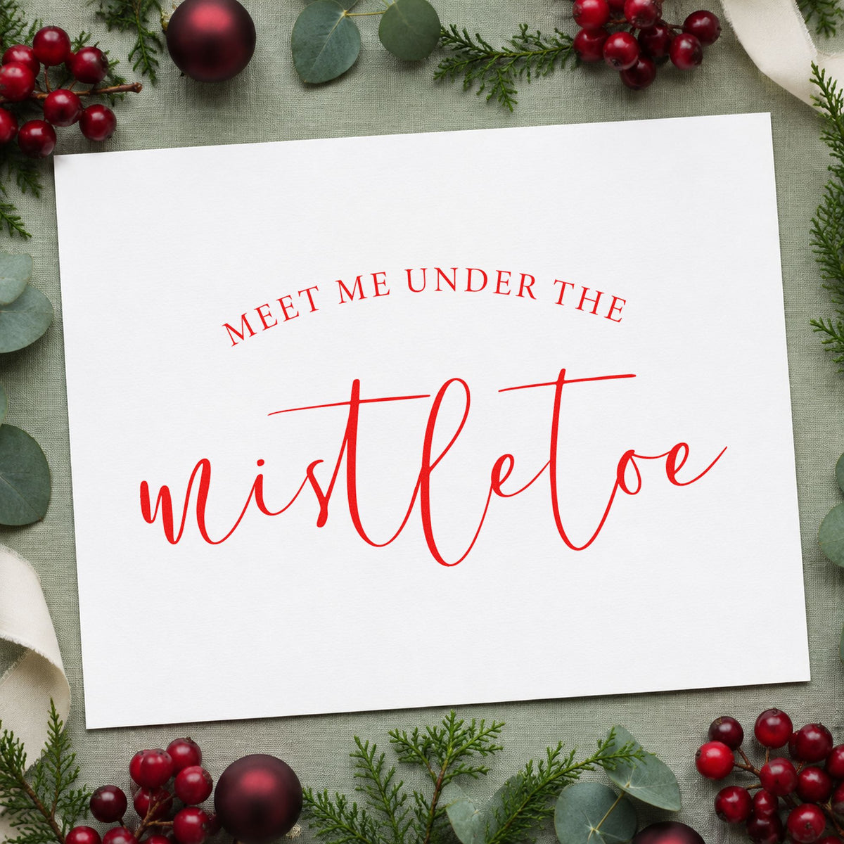 Meet Me Under Mistletoe Script rubber stamp shown in red ink, stamped for projects such as lid curve labels.