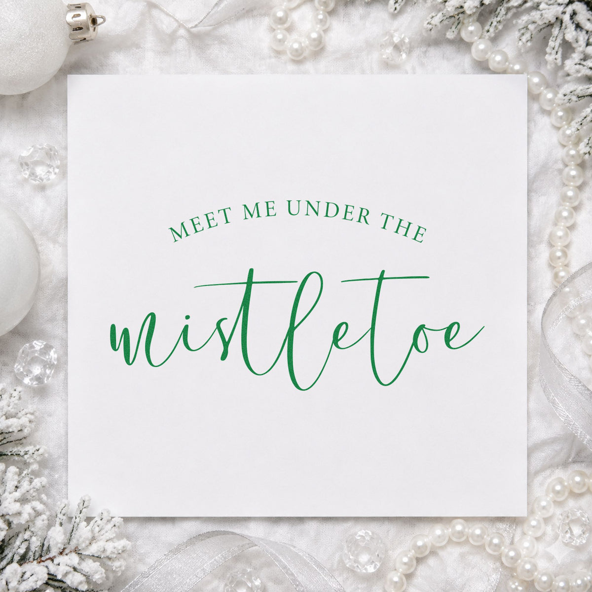 Meet Me Under Mistletoe Script craft stamp imprint in green ink on a handmade project, one idea being doorway span cards.