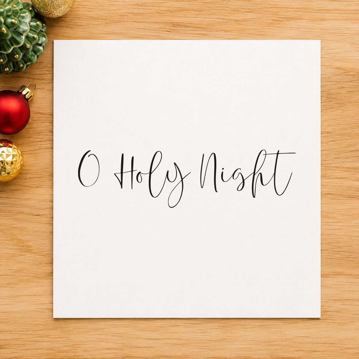 O Holy Night Fine Script craft stamp imprint in black ink on a handmade project, one idea being narrow band tags.