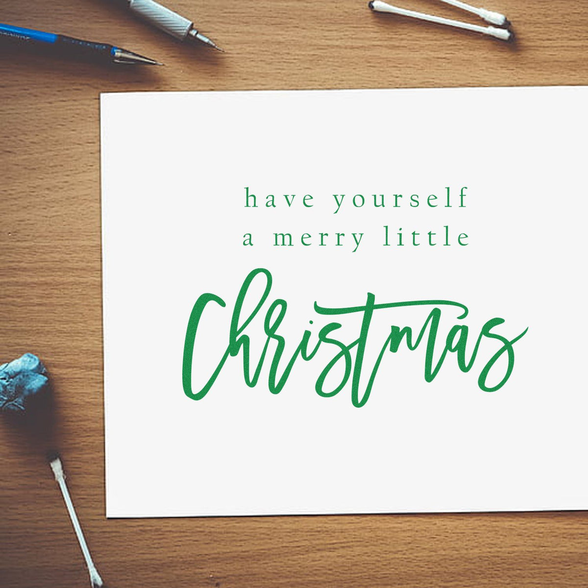 Have Yourself Merry Little Christmas rubber stamp shown in green ink, stamped for projects such as lettering study album.