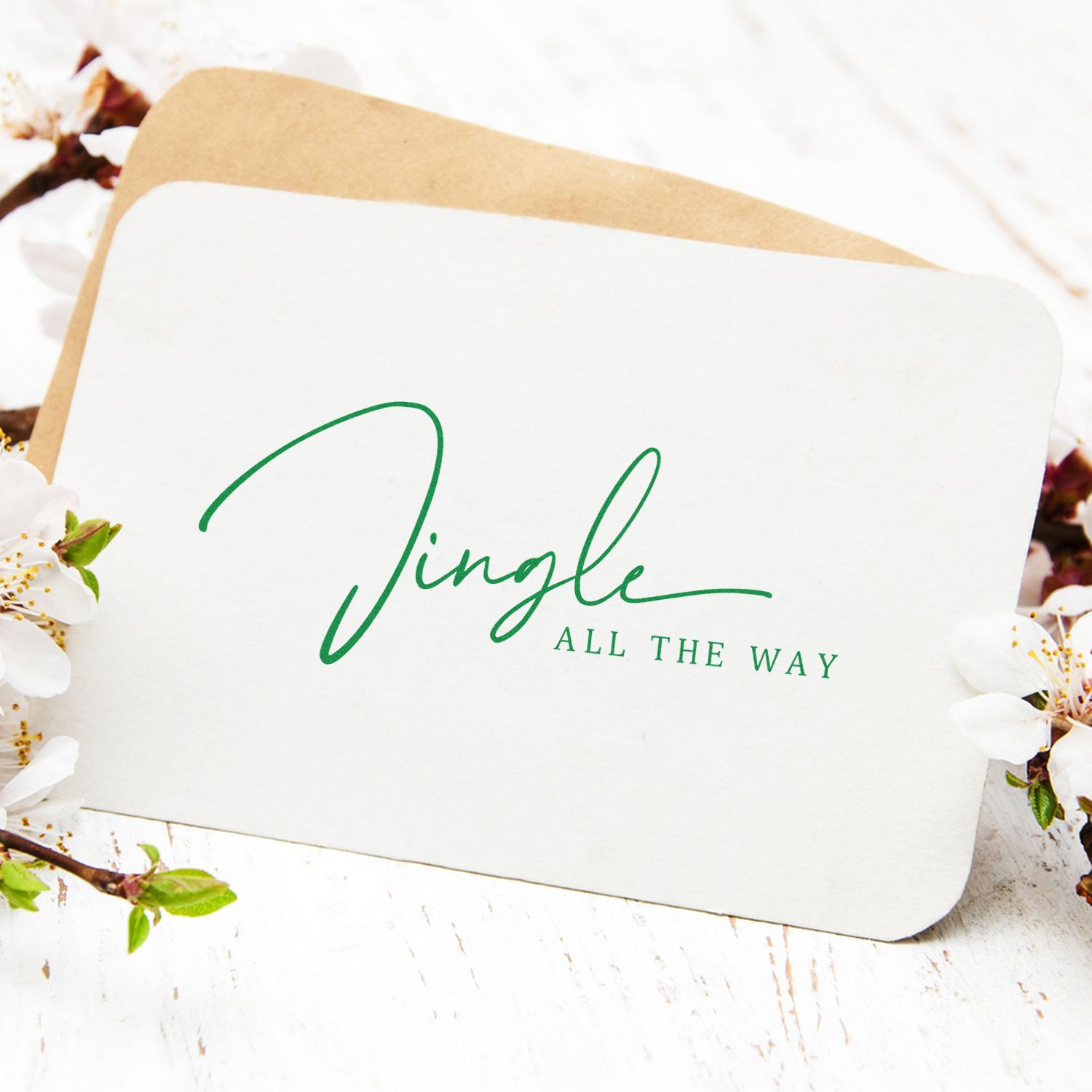 Christmas rubber stamp design reading Jingle All the Way on a greeting card mockup.