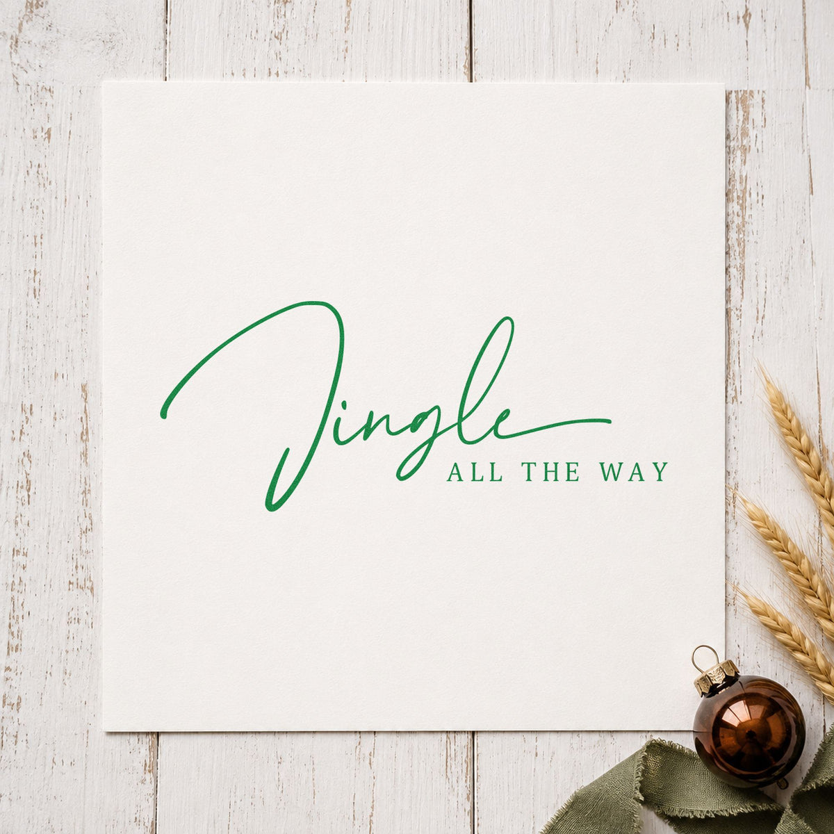 Jingle All The Way Fine craft stamp imprint in green ink on a handmade project, one idea being tea menu slips.