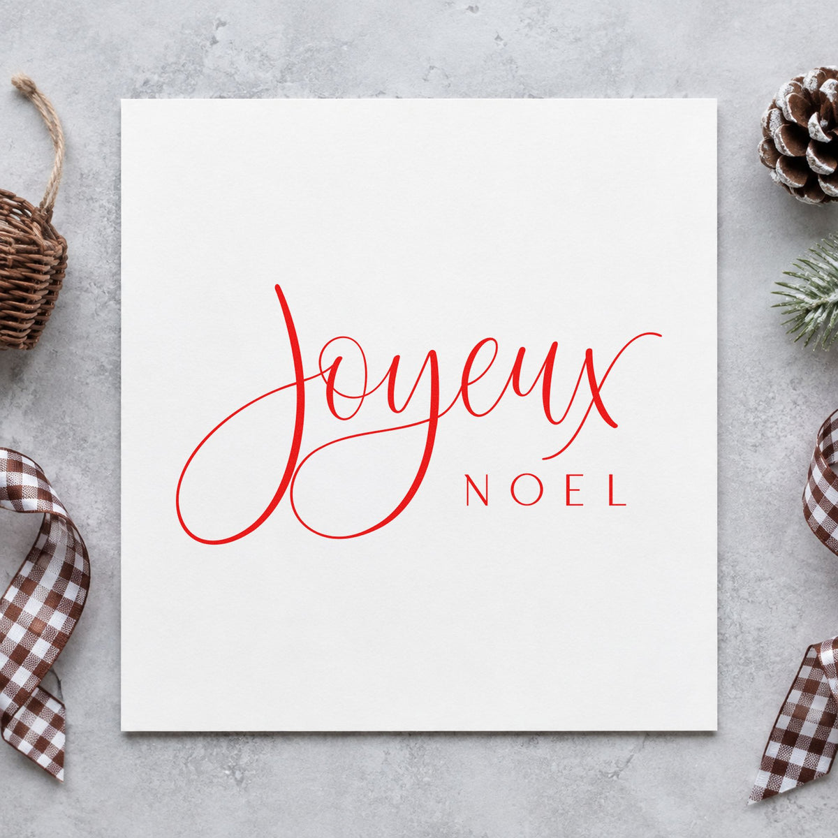 Joyeux Noel Fine Script rubber stamp shown in red ink, stamped for projects such as confiture jar labels.