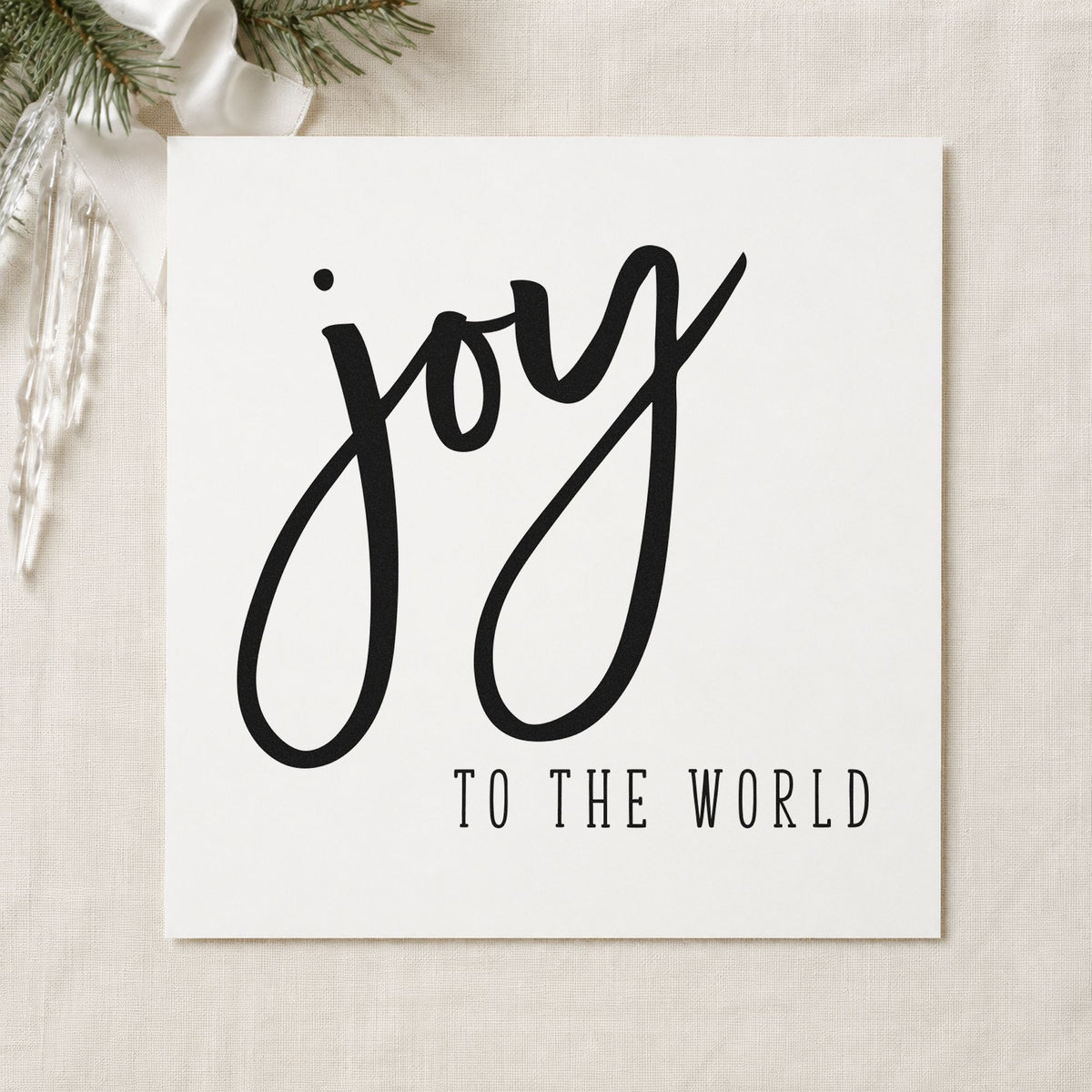 Joy To The World Brush craft stamp imprint in black ink on a handmade project, one idea being contrast gift tags.