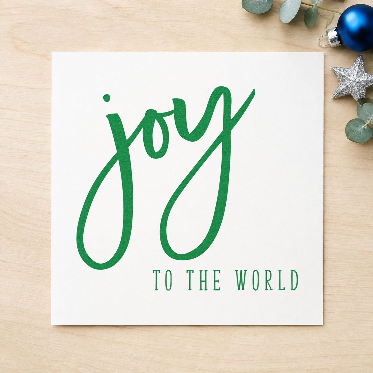 Joy To The World Brush craft stamp imprinted in green ink on paper, a design suited to framed contrast pair.