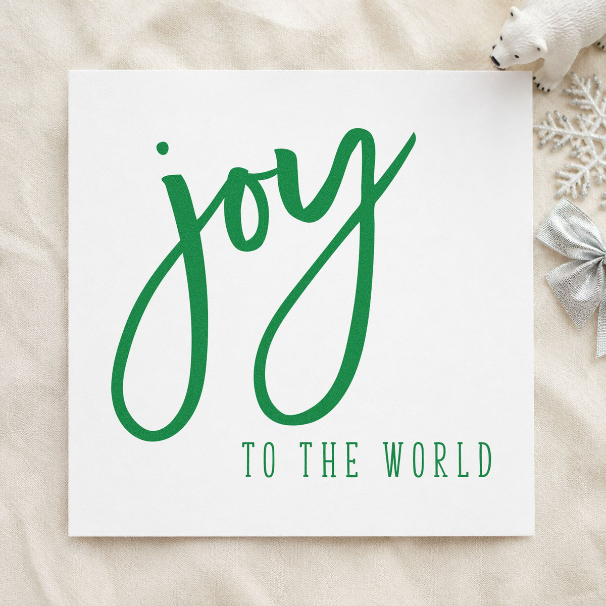 Joy To The World Brush craft stamp imprint in green ink on a handmade project, one idea being poster board slips.