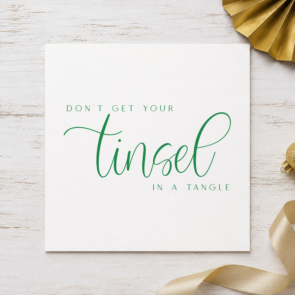 Don't Get Tinsel Tangled craft stamp in green ink on cardstock, an easy option for chaos album page.