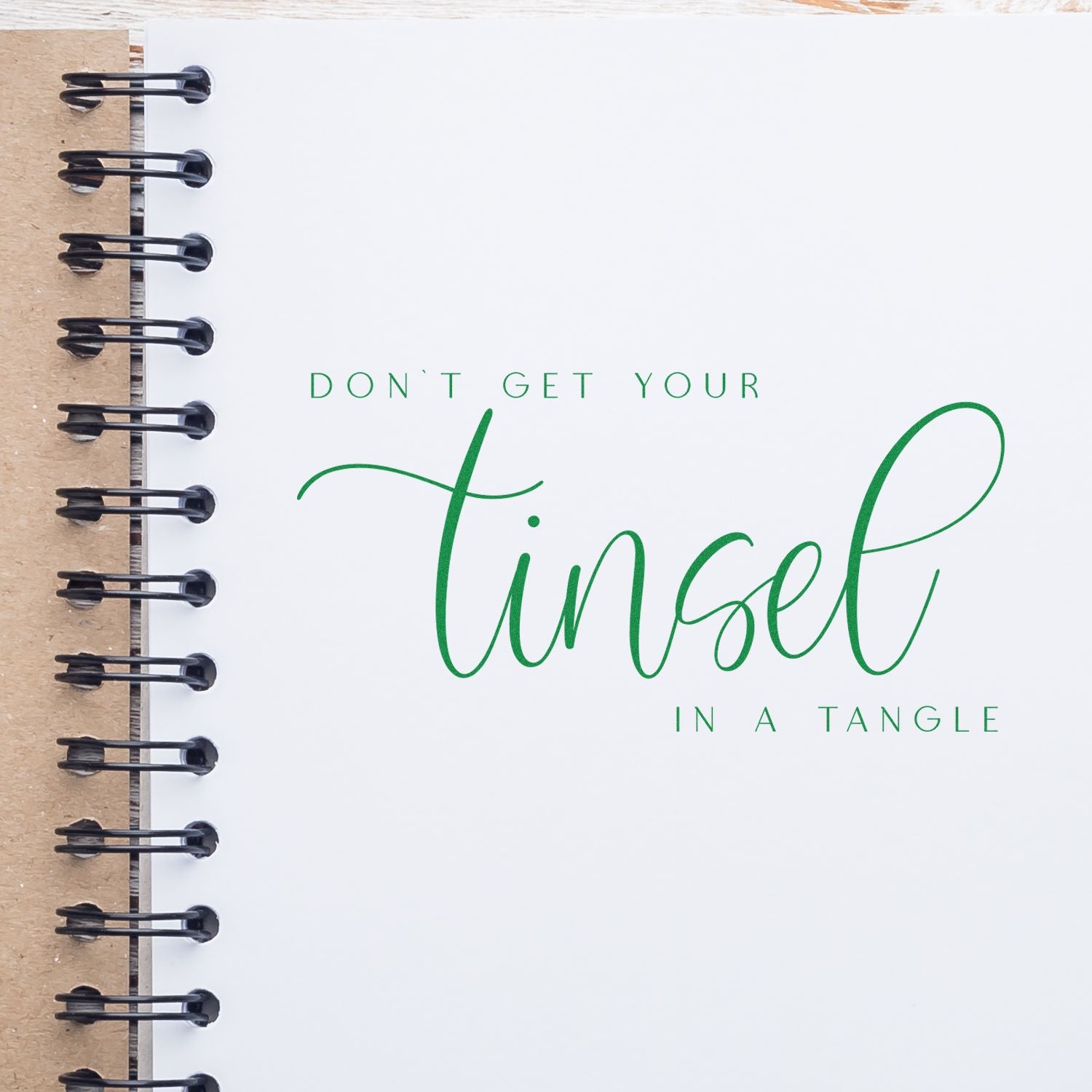 Custom rubber stamp design reading Dont get your tinsel in a tangle for holiday cards, journals, and crafts.