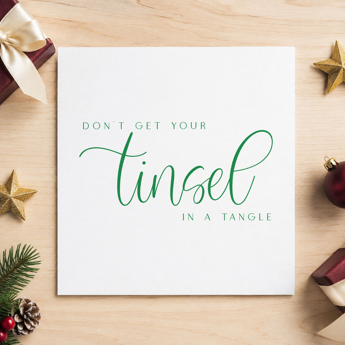 Don't Get Tinsel Tangled craft stamp imprinted in green ink on paper, a design suited to framed desk reminder.