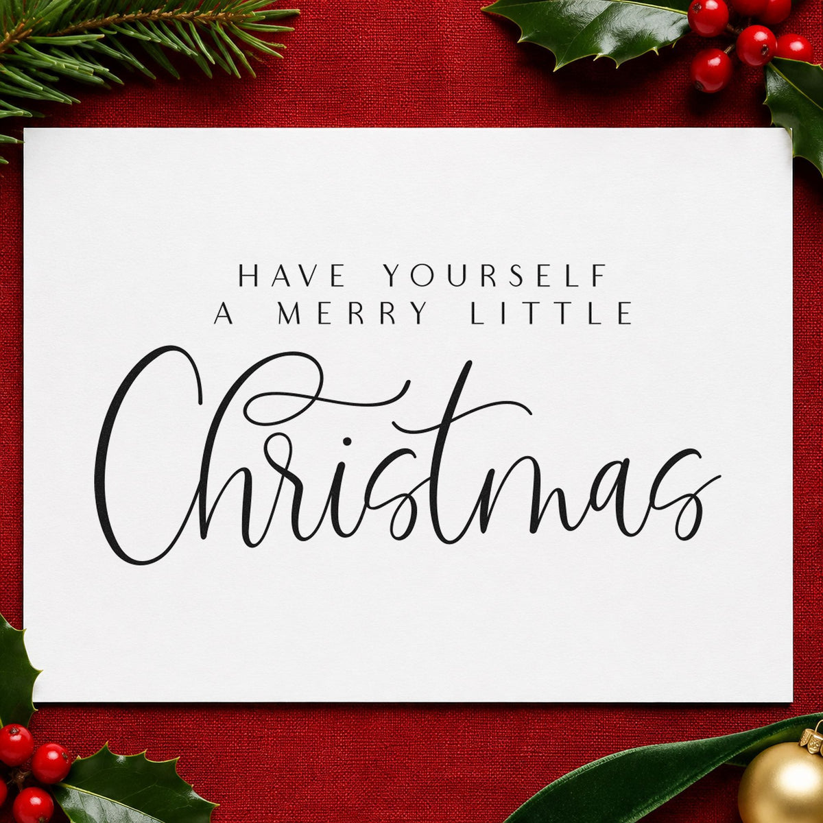 Merry Little Christmas Calligraphy craft stamp imprint in black ink on a handmade project, one idea being vinyl sleeve tags.