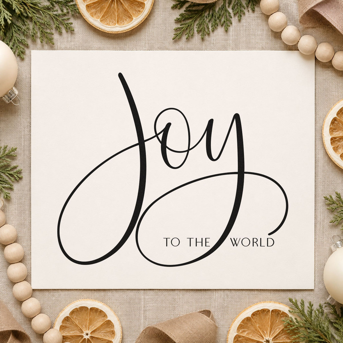 Joy To The World Loops craft stamp imprint in black ink on a handmade project, one idea being single term tags.