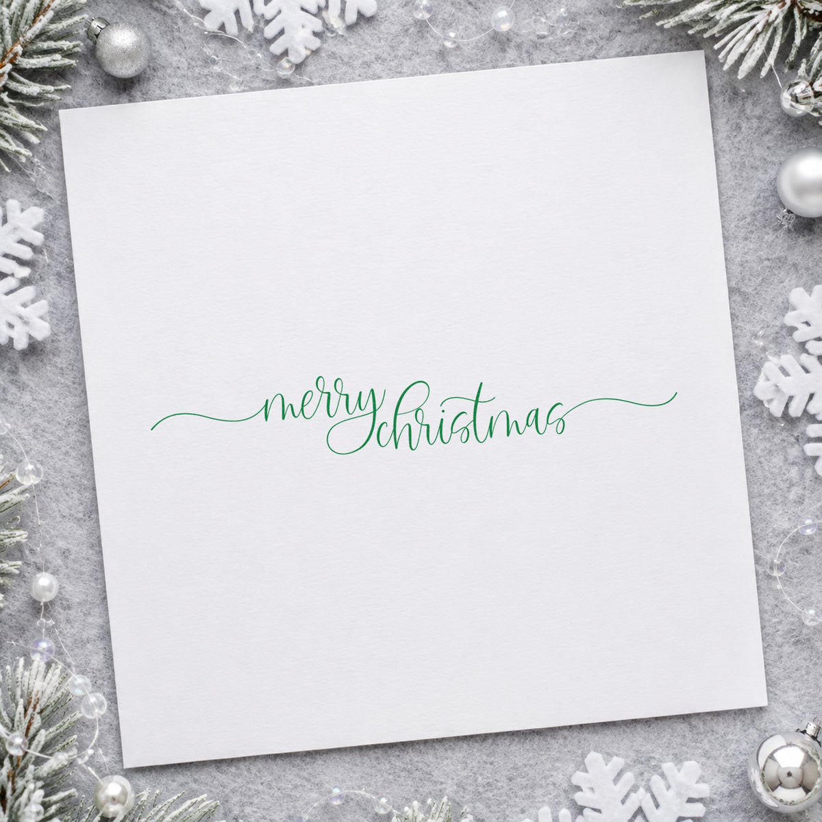 Merry Christmas Fine Flourishes craft stamp in purple ink on cardstock, an easy option for panorama album page.