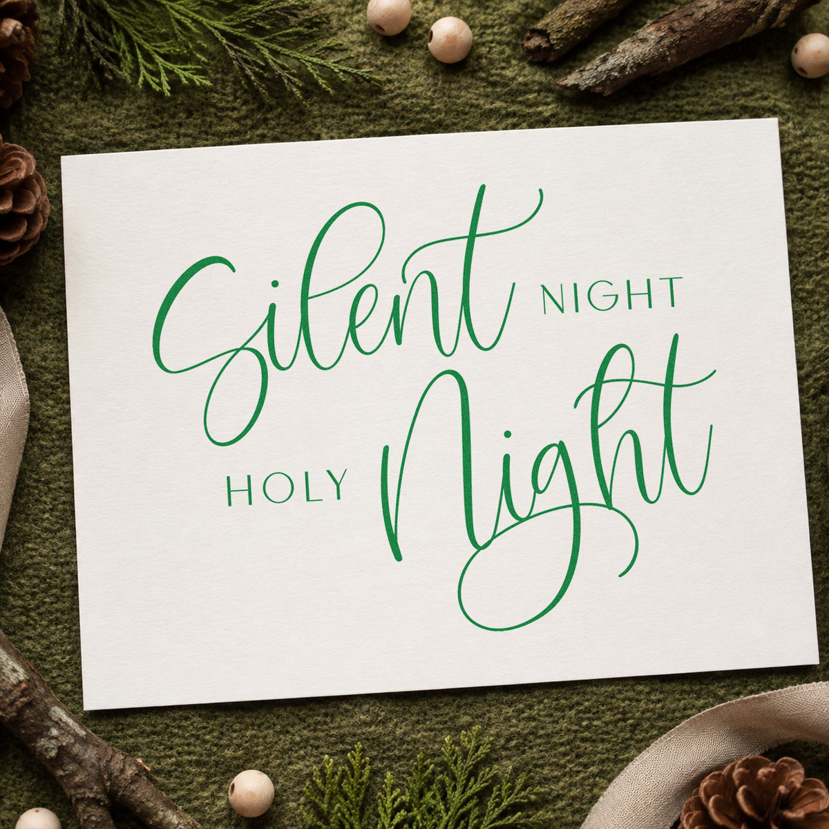 Silent Night Holy Night Calligraphy craft stamp imprint in green ink on a handmade project, one idea being antiphon slip cards.