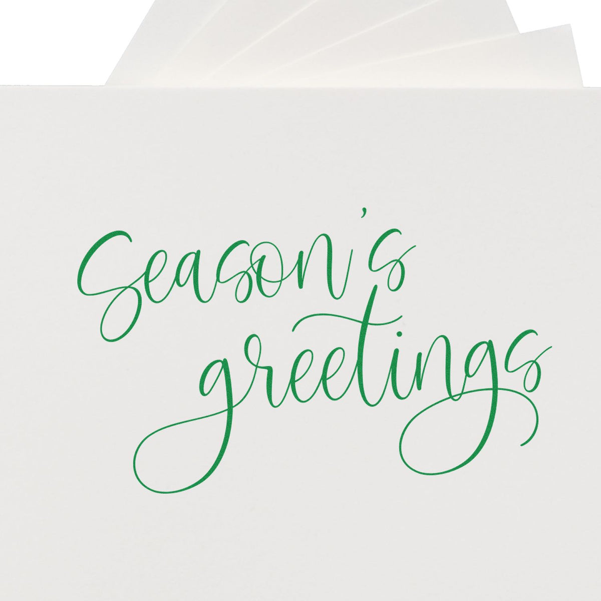Season's Greetings Fine Calligraphy rubber stamp shown in green ink, stamped for projects such as sample album page.